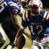 Photo: Liberty quarterback Kaimana Nacua runs out of the Photo: Liberty quarterback Kaimana Nacua runs out of the